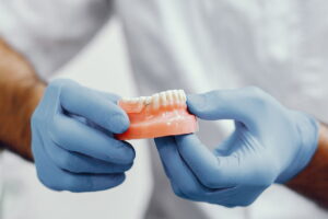 Full Mouth Rehabilitation : Dental Implants VS Dentures